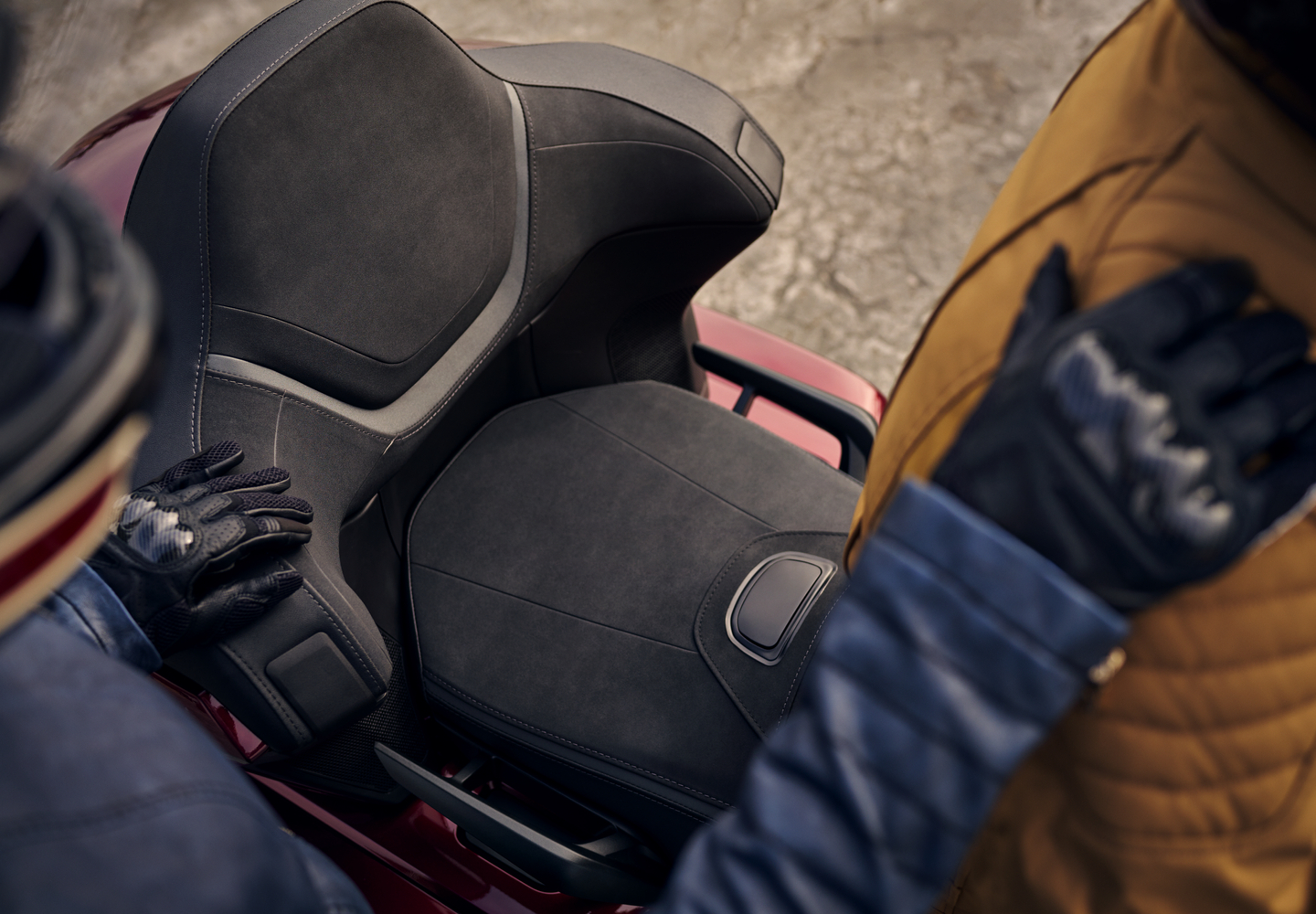 Passenger backrest and integrated grab handles