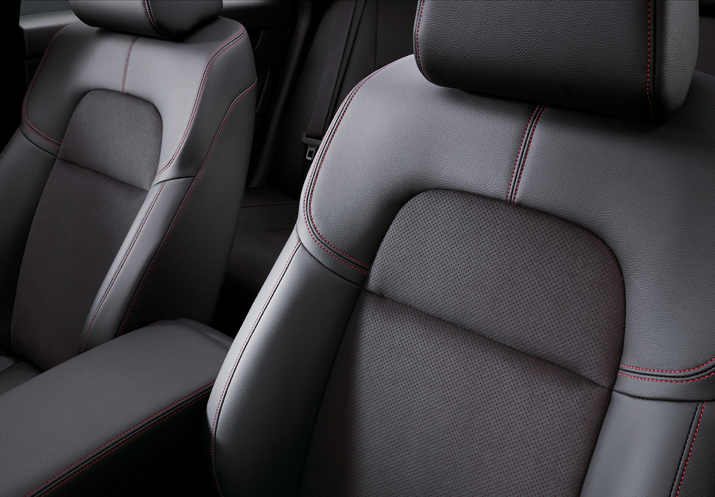 Black Leatherette Seats with Red Accented Suede